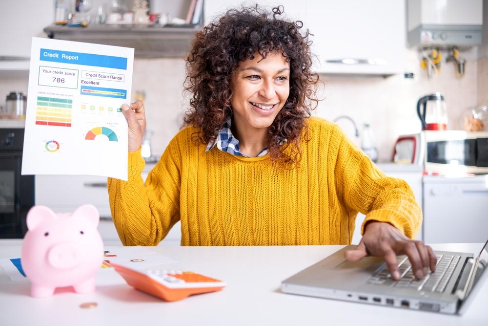 Happy woman with good credit score - 5 Tips for Improving your Credit Quickly